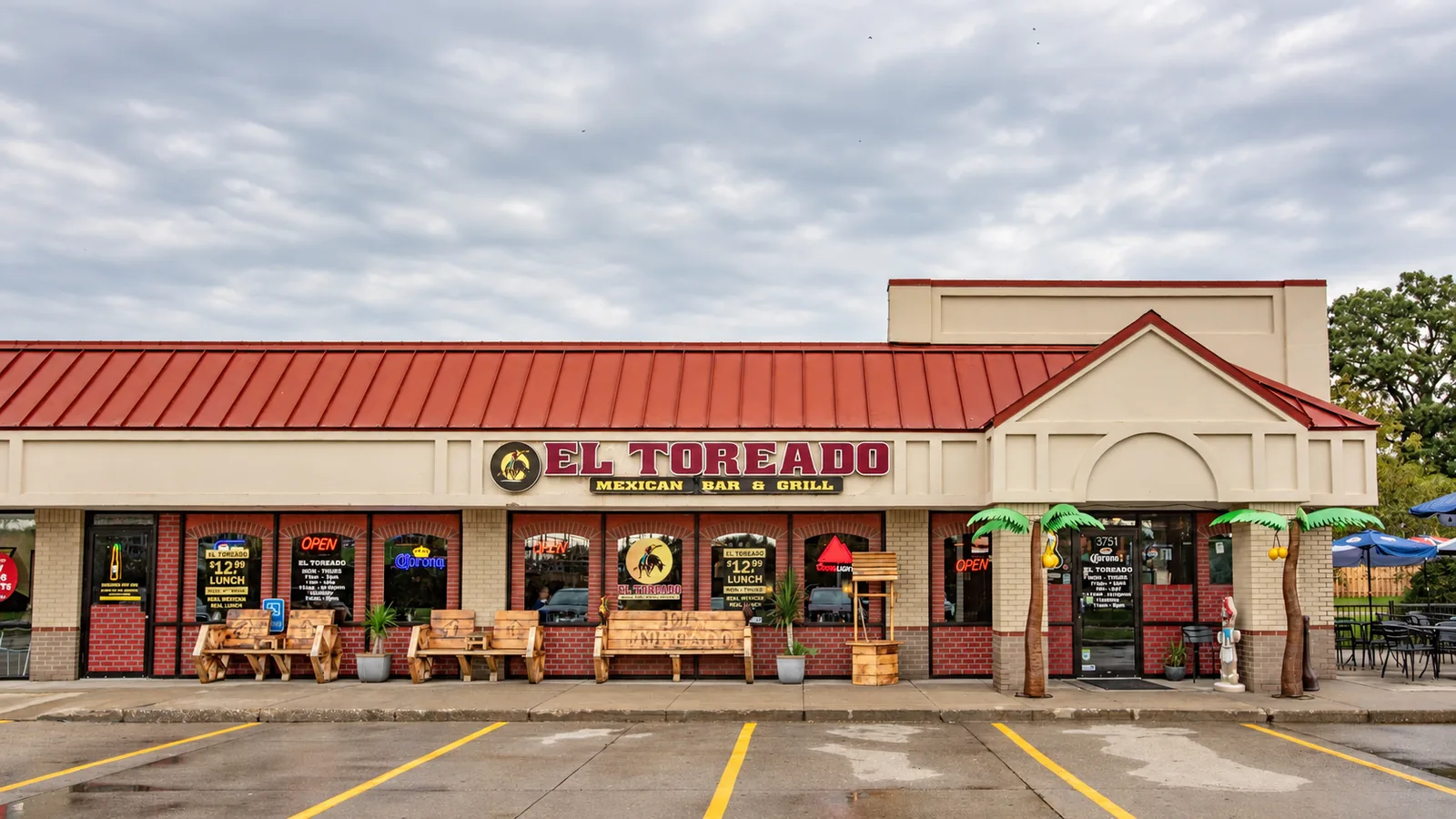 El Toreado Mexican Bar & Grill storefront on EP True Parkway in West Des Moines, with the red roof, sign and front benches